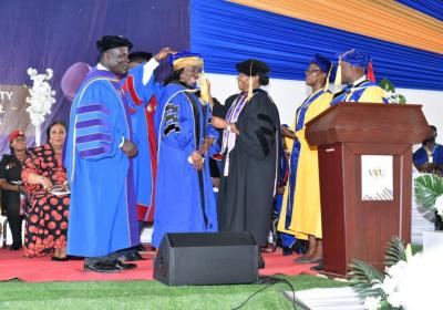 H. E. Former First Lady of Ghana, Nana Konadu Agyeman-Rawlings being robed by the Acting Pro Vice-Chancellor, Prof. Ninon P. Amertil (3rd from right)and assisted by the the Chancellor, Pr. (Prof.) Robert Osei-Bonsu