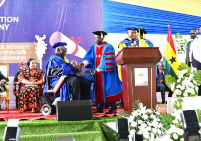 H. E. Former President of Ghana, John Agyekum Kufuor, robed in an Honorary Doctoral Gown and receiving a Certificate from the Chancellor of VVU, Pr. (Prof.) Robert Osei-Bonsu. 7-7-2023