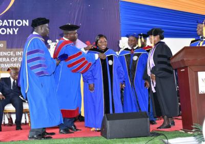 Hon. Chief of Staff, Akosua Frema Osei-Opare, robed in an Honorary Doctoral Gown and assisted by the Chancellor of VVU, Pr. (Prof.) Robert Osei-Bonsu (2nd, left). 7-7-2023